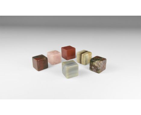 A group of cut and polished mineral cubes including: agate, red jasper, rose quartz and others. See Bonewitz, Dr. Ronald Loui