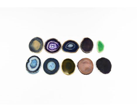 A group of ten cut and polished agate slices showing a range of colour and some with honeycomb crystal growth; some colour en