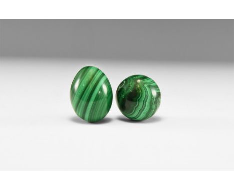 A pair of polished malachite egg and sphere with dark and light green banding. See Bonewitz, Dr. Ronald Louis, Rocks & Minera