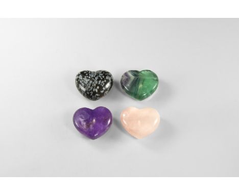 A group of polished gemstone hearts including: amethyst, fluorite, rose quartz and snowflake obsidian. See Bonewitz, Dr. Rona