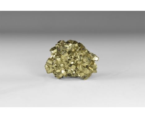 A group of fine pyrite crystals forming principally as cubes modified by octahedrons, deeply striated and lustrous, with smal