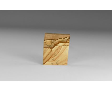 A square piece of paesina with the layers picked out in iron oxide minerals displaying the characteristic naturally occuring 