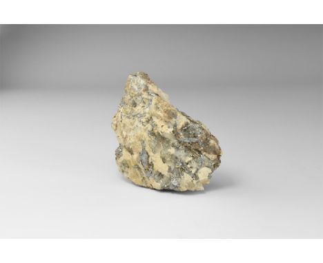 A specimen of loellingite in quartz, from Cornwall, with bright veins of the mineral throughout the specimen, in old white ca