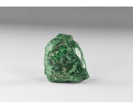 A piece of sawn malachite with lustrous green, blue and black clolouring. See Bonewitz, Dr. Ronald Louis, Rocks & Minerals, 2