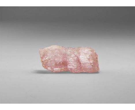 An interesting and unusual kunzite crystal from Pakistan, showing natural chemical erosion of the faces, and with two rectang