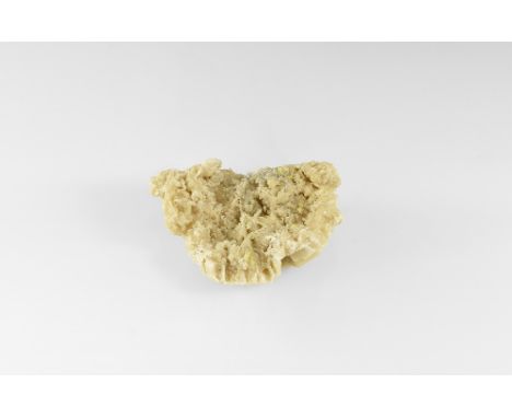A large piece of zincian aragonite formed as numerous hexagonal crystal plates, coated with small crystals, in white card tra