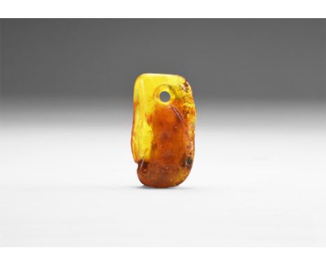 A large polished rectangular piece of Baltic amber with inclusions throughout the body and hole drilled to the top for suspen