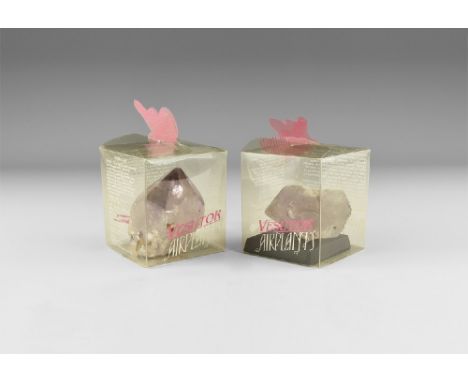 A pair of amethyst crystals with well formed facets and a pale purple colour darkening at the tips and with rainbow reflectio