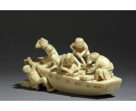 A late 19th century Japanese netsuke-okimono from Meiji period. Signed Nagahide. In carved elephant ivory portraying a group 