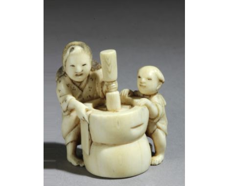 A Japanese netsuke circa 1825-1870 from Edo period. Signed Gyokuyosai. In carved elephant ivory portraying a mother with her 