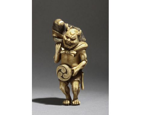 A late 19th century Japanese netsuke from Meiji period. Signed Gyokusen on the back. In carved elephant ivory portraying a st