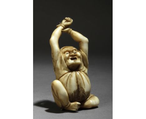 A mid 19th century Japanese netsuke from Edo period. Signed Nagamitsu (Choko). In carved elephant ivory portraying a Daruma s