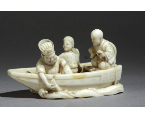 A Japanese netsuke circa 1860-1880 from Meiji period. Signed Yuzan. In carved elephant ivory portraying a group of characters