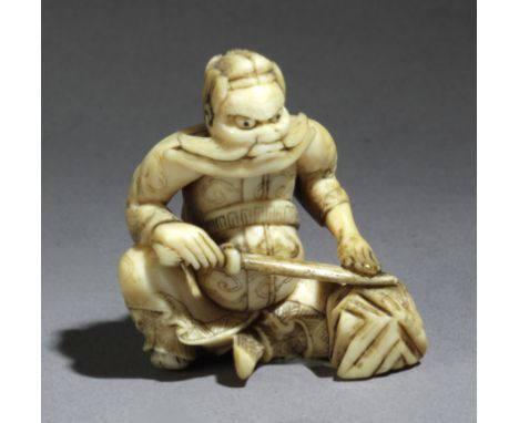 A mid 18th century Japanese netsukefrom Edo period. Signed Hidemasa. In carved elephant ivory portraying a "Shoki" sat on the