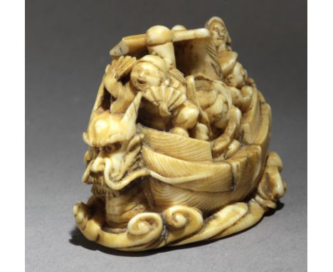 A late 19th century Japanese netsuke from Meiji period. In carved elephant ivory portraying a 'takarabune', the ship where Se