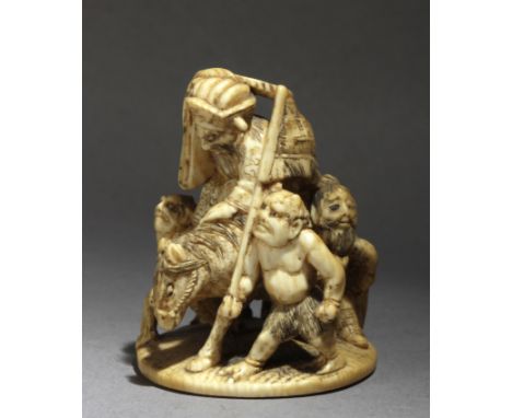 A mid 19th century Japanese netsuke okimono from Edo period. Signed Tomogyoku or Yugyoku on the base. In carved ivory portray