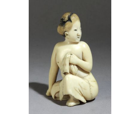 An 18th century Japanese netsuke from Edo period. Not signed. In carved and partially polychromed elephant ivory portraying a