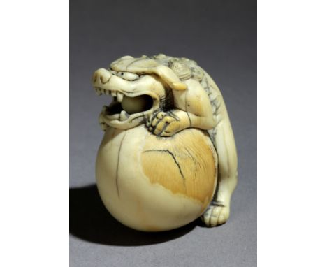 A late 18th century Japanese netsuke from Edo period. Signed Seirin on a side. In carved elephant ivory portraying a standing