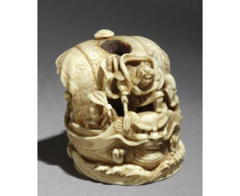 A late 19th century netsuke okimono from Meiji period. Signed Gyokuzan on the base. In carved elephant ivory portraying a tak