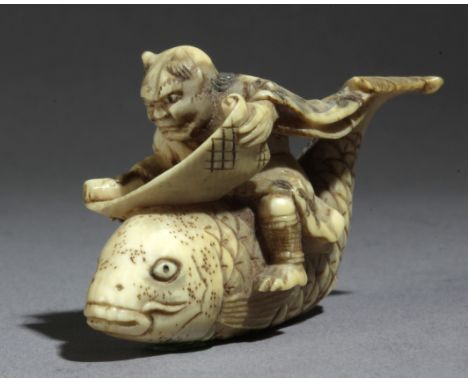 A late 19th century Japanese netsuke from Meiji period. Signed Masatsugu. In carved elephant ivory portraying an Oni riding a
