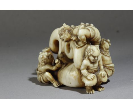 A 19th century Japanese netsuke okimono from Meiji period. Signed on the base. In carved ivory portraying a group of five Oni