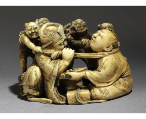 A 19th century Japanese netsuke okimono from Meiji period. Signed Masatomo on the base. In carved elephant ivory portraying a