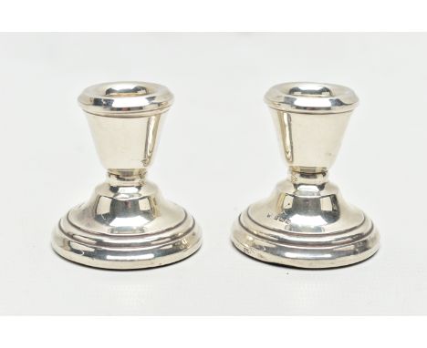 A PAIR OF SILVER CANDLESTICKS, dwarf candlesticks, tapering in form to the round stepped, weighted bases, each hallmarked 'ES