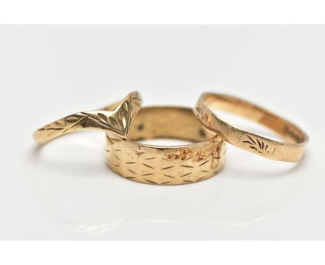 THREE 9CT YELLOW GOLD RINGS, to include a wide band with engraved detail, a wish bone ring and a faceted ring with plain poli