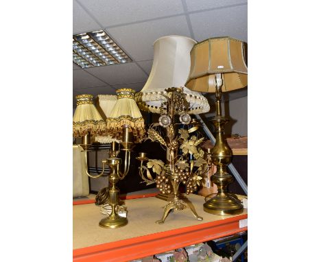 A GROUP OF BRASS TABLE LAMPS, together with a French Provincial grape and wheat sheaf harvest motif five arm, gilt metal cand