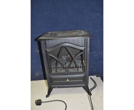 AN UNBRANDED LOG BURNER EFFECT CONVECTION HEATER with log effect detail inside (light not working) width 39cm depth 27cm heig