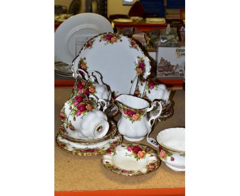 A ROYAL ALBERT 'OLD COUNTRY ROSES' PATTERN PART TEA SET, comprising milk jug, sugar bowl, bread and butter plate, six cups, s