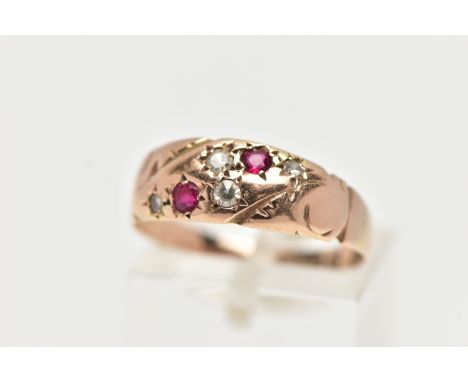 A 9CT GOLD EDWARDIAN RING, four single cut diamonds and two circular cut rubies set within a rose gold band, engraved with sc