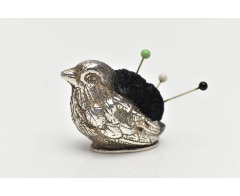 A SILVER NOVELTY PIN CUSHION, designed as a chick, approximate length 40mm, maker's mark H&amp;SJ?, hallmarked London, 1980, 