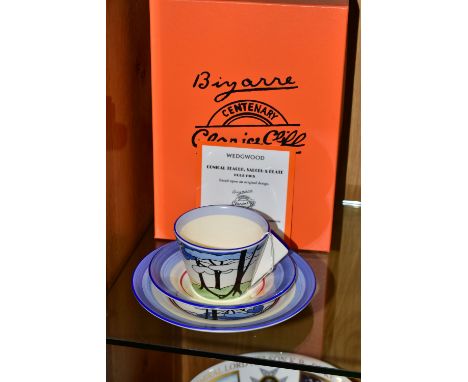 A BOXED WEDGWOOD CLARICE CLIFF LIMITED EDITION 'BLUE FIRS' TRIO, based on an original design by Clarice Cliff, comprising con