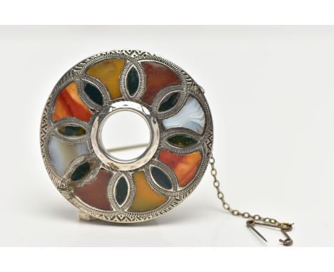 A SCOTTISH AGATE BROOCH, of a circular form set with various agates, in a white metal mount unmarked, fitted with a brooch pi