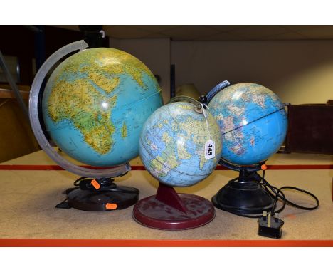 TWO ILLUMINATED WORLD GLOBE LAMPS, together with a tin Chad Valley globe, wood grain effect to tin base (slight dents and rus