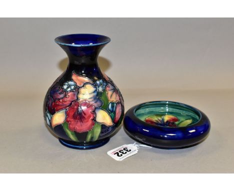 A MOORCROFT POTTERY 'ORCHID' PATTERN VASE AND BOWL, each tube lined with purple and pale yellow orchids on a blue/blue green 