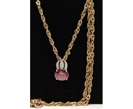 A 9CT YELLOW GOLD SPINEL AND DIAMOND PENDANT WITH CHAIN, the pendant set with a principal purplish red spinel, to the single 
