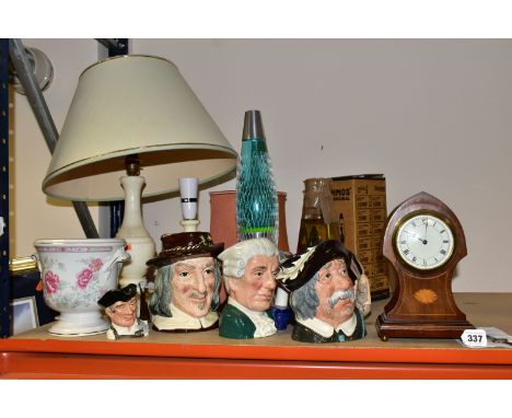 A GROUP OF CHARACTER JUGS AND TABLE LAMPS, to include an Edwardian keyhole shaped mantle clock with key and a receipt from 20