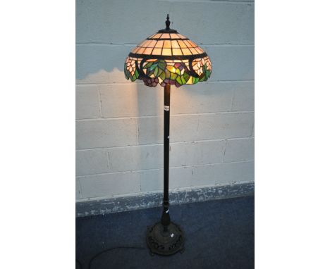 A TIFFANY STYLE STANDARD LAMP, on a metal base, height 144cm