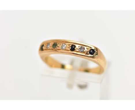 A GEM SET RING, yellow metal band ring grain set with three single cut diamonds, two sapphires and two emeralds, unmarked, ri