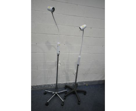 THREE BRANDON ADJUSTABLE MEDICAL LAMPS, on casters, and a floor lamp (4)