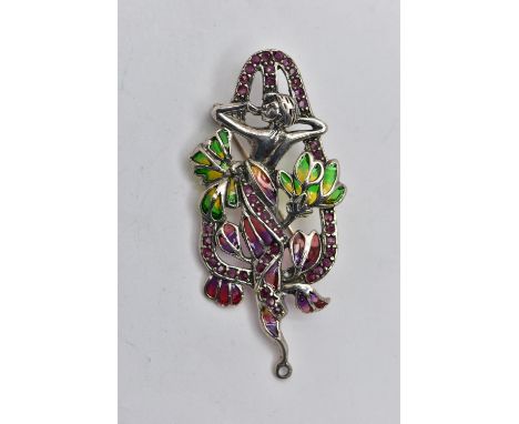 A WHITE METAL PLIQUE A JOUR BROOCH/PENDANT, Art Nouveau style of a lady between flowers, decorated with green, yellow and red