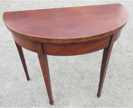 George III rosewood banded and boxwood strung mahogany folding tea table, on twin gate action square tapered supports with sp