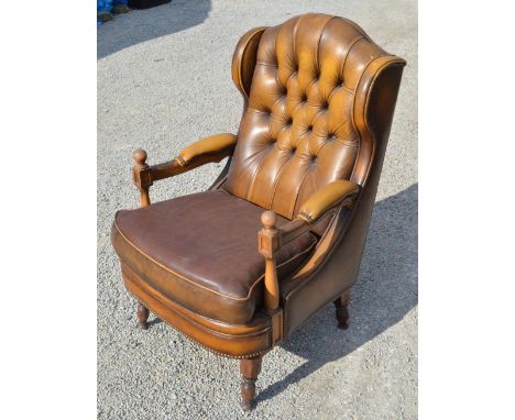 Leather upholstered open armchair, arched button wingback on turned supports, W65cm D70cm H110cm 