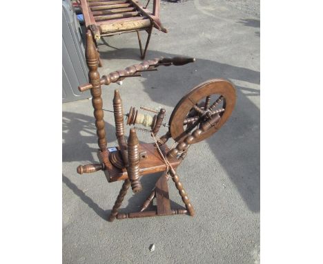 Victorian style oak spinning wheel on bobbin turned tripod base 