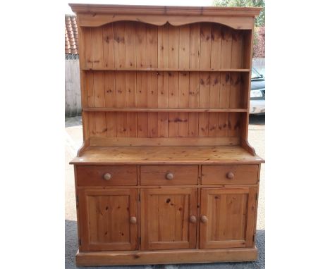 Pine farmhouse dresser, twin shelf back above three drawers and three cupboard doors, on plinth base (146cm x 190cm x 60cm) 