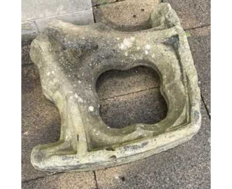 A weathered stone architectural element with a central quatrefoil aperture, 70cm by 75cm