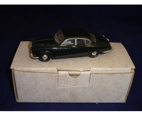 A Conquest Models 1:43 Scale 1967 Jaguar 420 in black.  Roof needs reattaching. G in G box.