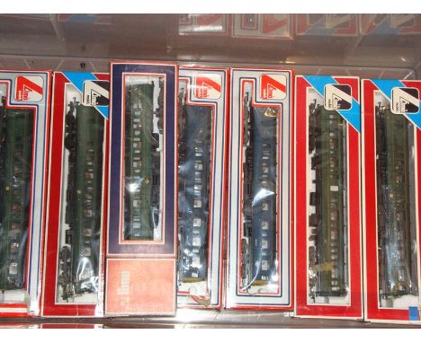 A group of Lima diesel multiple units comprising a 2-car unit in BR blue, a 3 car unit in BR green and a further 2 car unit i